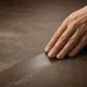 A hand on wood